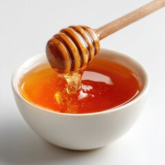 Honey pot and dipper on white background.