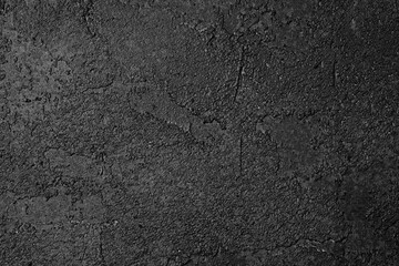 Black and white textured wall with dramatic mottled pattern and contrast