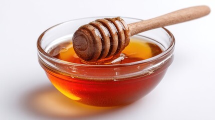 Honey pot and dipper on white background.