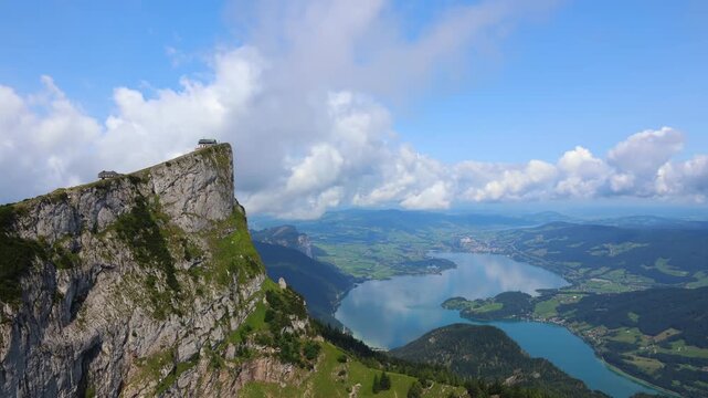 Schafberg mountaintop with Mondsee lake, cloud time lapse. Austria landscape, travel destionation background