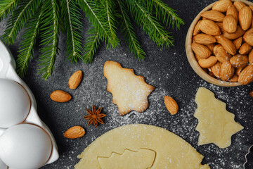 Christmas cookie dough and baking scene with rolling pin, eggs and spices for seasonal preparation...