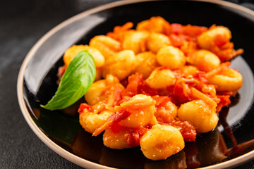Gnocchi tomato sauce fresh delicious gourmet food background on the table  rustic food top view copy space