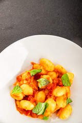Gnocchi tomato sauce fresh delicious gourmet food background on the table  rustic food top view copy space