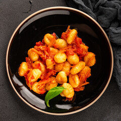 Gnocchi tomato sauce fresh delicious gourmet food background on the table  rustic food top view copy space