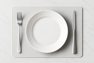 Empty white plate mockup with fork and knife on minimalist placemat over marble background for branding or menu presentation concept. Ai generative