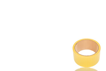 One roll of masking tape, close-up, isolated on white background.