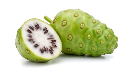 Whole and halved green noni fruit with visible seeds on white background