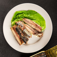 Sardine canned food sprats fish seafood fresh pescetarian diet gourmet food background on the table rustic food top view copy space keto and paleo diet