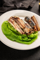 Sardine canned food sprats fish seafood fresh pescetarian diet gourmet food background on the table rustic food top view copy space keto and paleo diet