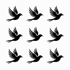Obraz premium Nine black silhouettes of birds in flight isolated on white background