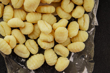 Gnocchi raw potato dough snack fresh delicious gourmet food background on the table  rustic food top view copy space vegetarian food
