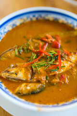 Mackerel fish with red curry sauce topped with shredded kaffir lime leaves and chilli. Thai name Mackerel Chu Chee.