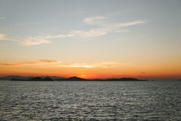 Obraz premium Beautiful scenery of sunset time in Labuan Bajo island, Indonesia.