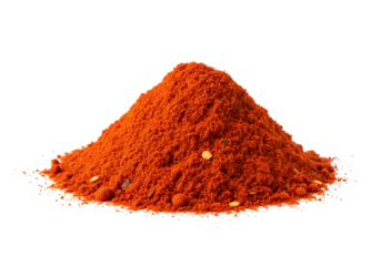 Bright orange spice powder heap on black background for culinary and culinary spice theme