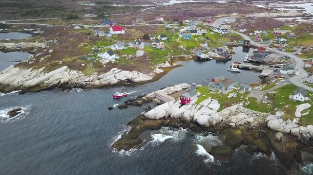 Aerial view of a coastal village in newfoundland, canada with rocky shores and ocean