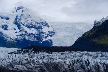 Witness the breathtaking beauty of Svinafellsjokull Glacier, surrounded by rugged mountains and icy...