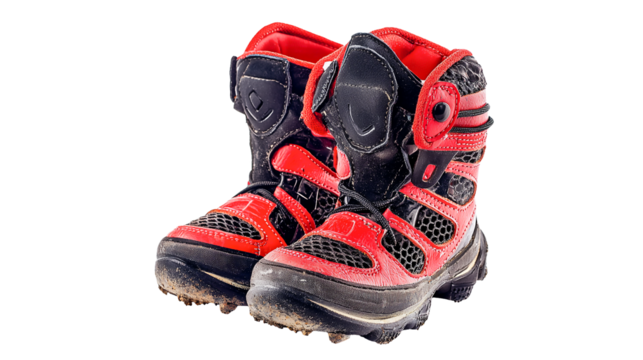 PNG a photo of a pair of red and black boots on a transparent background