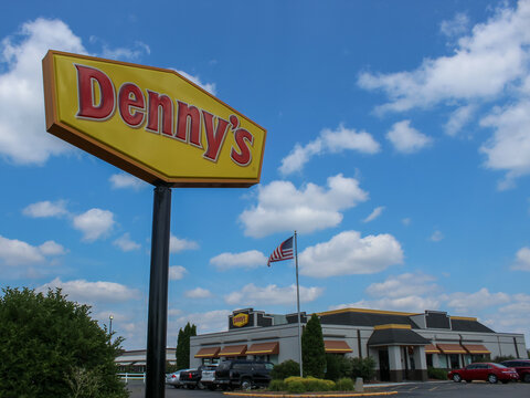 Rothschild, WI (USA) - August 14, 2025: A Denny's sign and building. The popular chain is known for its classic American diner fare, breakfast items, and comfort food. Editorial Use Only.
