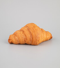 Croissant isolated on a grey background, clipping path included.
