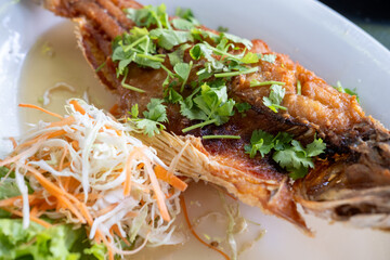 Deep-fried Sea bass with Fish Sauce served on plate