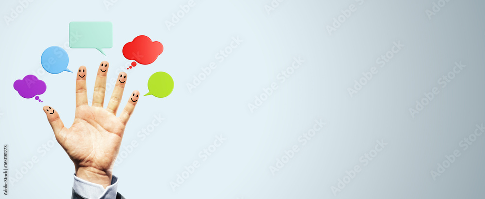Poster hand with smiley face fingers and colorful speech bubbles on a light background representing communi
