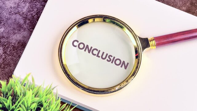The text of the CONCLUSION appears on the paper through a magnifying glass