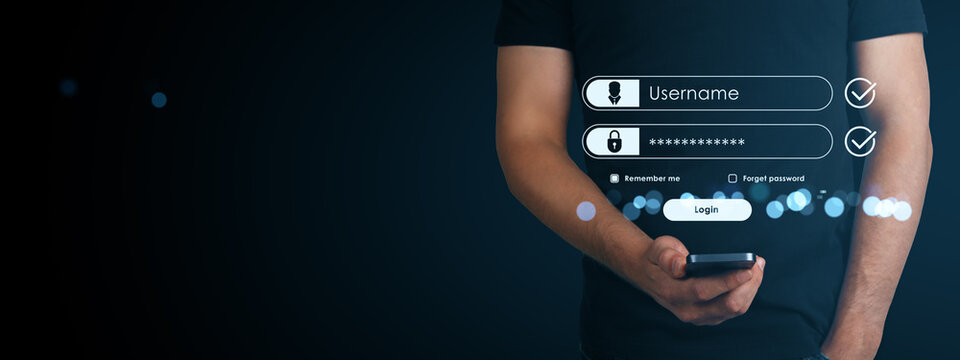 Man using smartphone with digital login form interface on dark background, symbolizing secure online access and user authentication screen.