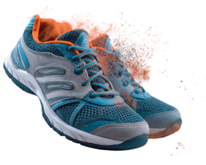 Tennis shoes pair with clay dust effect  isolated on white background