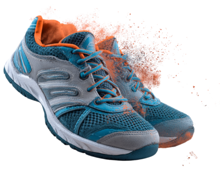 Tennis shoes pair with clay dust effect  isolated on white background