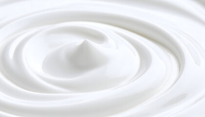 Close Up View of a Swirling White Creamy Texture with a Smooth Surface and Spiral Design