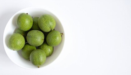 Fototapeta premium Green walnuts isolated on white background