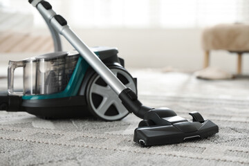 One vacuum cleaner on floor indoors, closeup