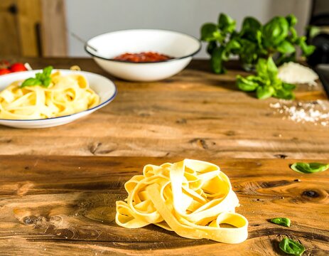 Fresh pasta ingredients on a rustic wooden table