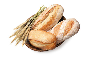 Loaves of fresh bread and spikes in bowl on white background, top view