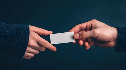 Close-up: Hands exchanging a business card, networking, professional introduction