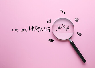 We are hiring. Inscription, icons and magnifying glass on pink background, top view