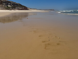 Tranquil footprints on serene sandy beach
