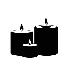 Black candles with flames for Halloween  