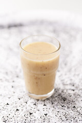Pineapple coconut smoothie on bright background. Soft focus. Copy space.
