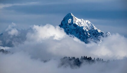 Mountain peak emerging from clouds