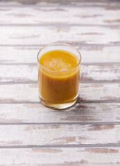 Mango smoothie on bright background. Soft focus. Copy space.	