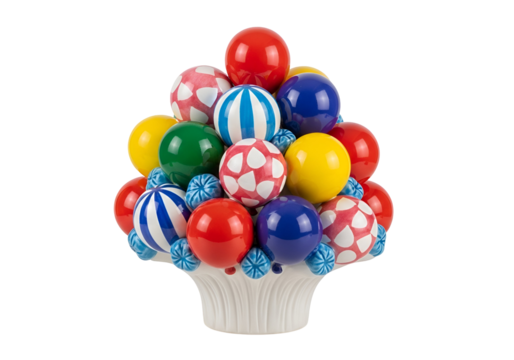 Vibrant cluster of colorful, patterned spheres in a decorative white vase against a black background.