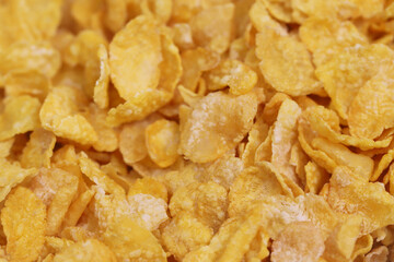 Yellow frosted corn flakes for dry, cereals breakfast. Healthy food.