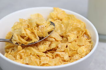 
Yellow frosted corn flakes bowl for dry, cereals breakfast. Healthy food.