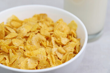 
Yellow frosted corn flakes bowl for dry, cereals breakfast. Healthy food.