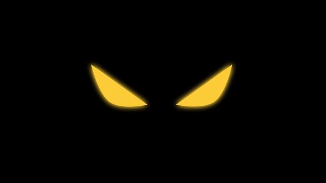 yellow cat's eyes watching and blinking in the dark. scary glow in the dark hellowen