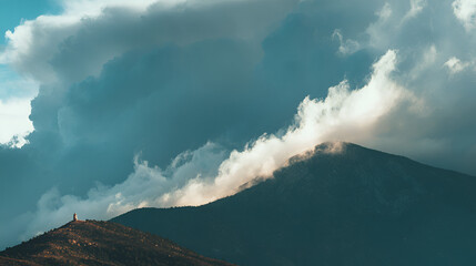 Dramatic Mountain Landscape:  Moody Cloudscape Over Hilltop Structure, Serene Teal Tones