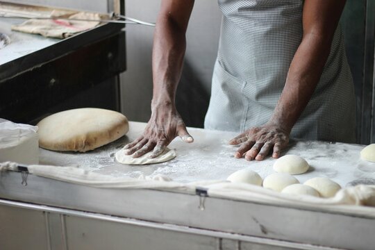 baker kneading dough