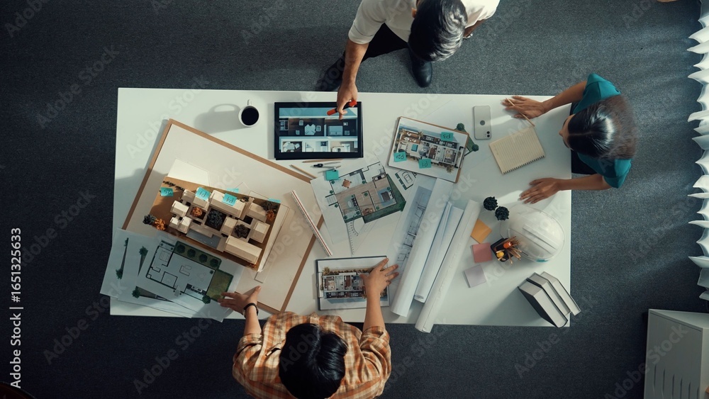 Poster top view of project manager working together to brainstorm house design while standing around meetin