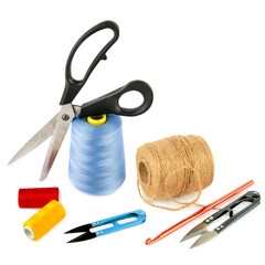 Ball of hemp rope, crochet hook and scissors isolated on white background.
